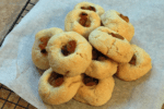 Manju red bean cookies piled on top of a piece of parchment paper.