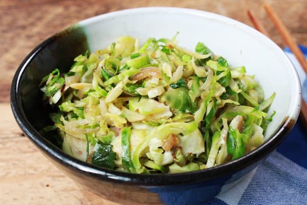 shaved brussels sprouts with shiitake mushrooms in a bowl