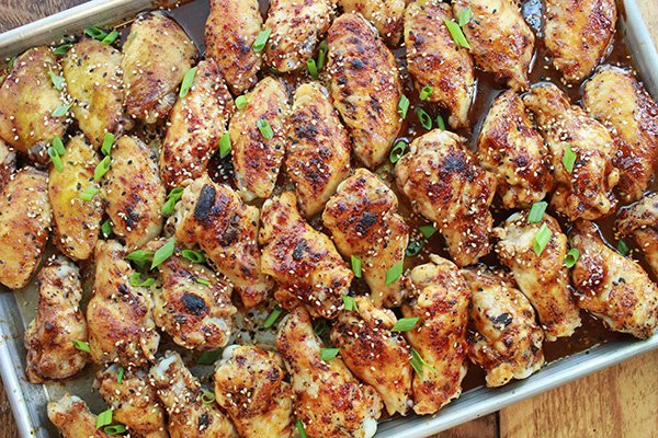 baked Korean chicken wings on a baking sheet right out of the oven