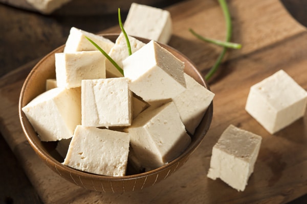 cubed tofu in a wooden bowl