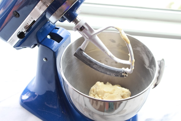 Chinese almond cookie dough in a blue stand mixer.