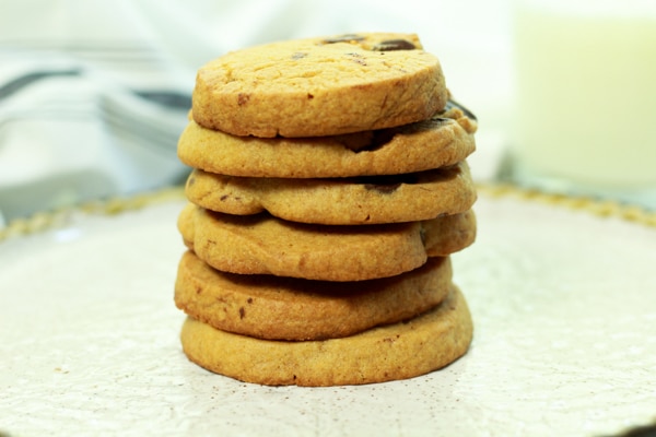 a stack of miso chocolate chip cookies on a white plate