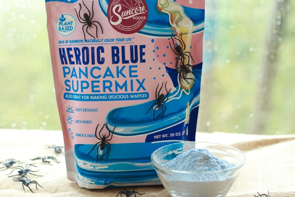 a package of Suncore Foods blue pancake mix and a small bowl of the powder alongside