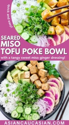 A black bowl filled with miso tofu poke bowl ingredients and white rice, with chopsticks and clear jar of miso ginger dressing on the side.